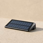 Black solar deck light with built-in solar panel